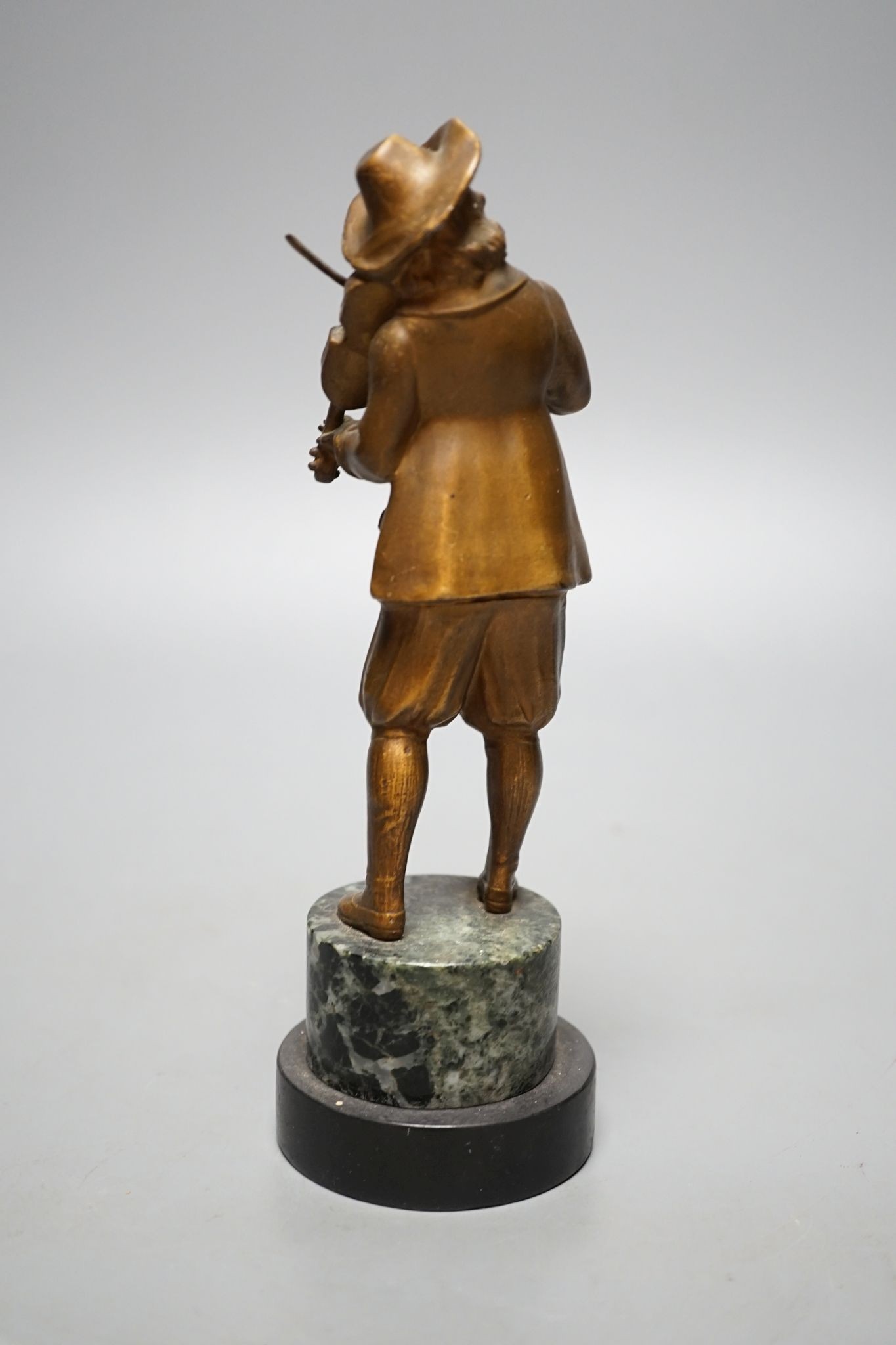 A pair of gilt spelter figures of magicians., 19 cms high.